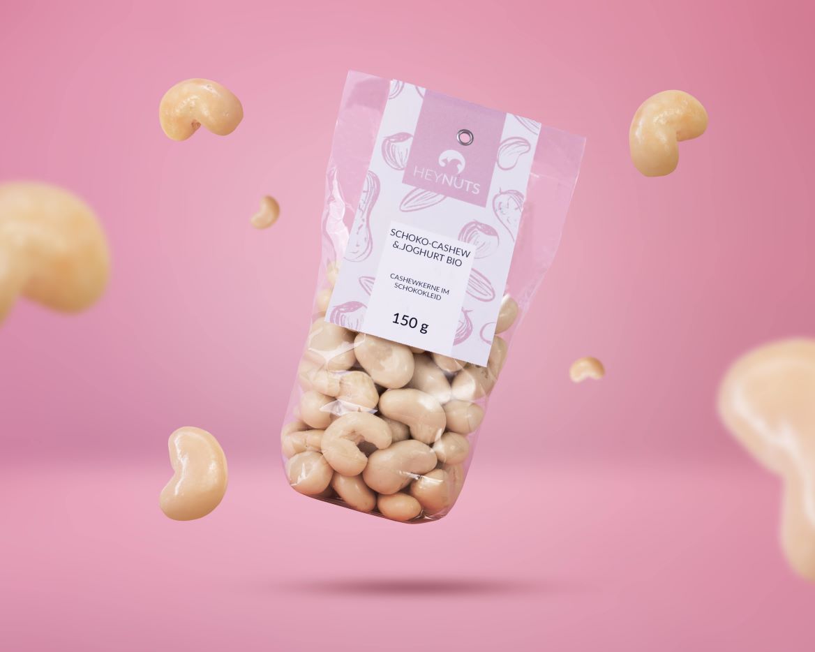 Cashewkerne in weißer Schokolade & Joghurt bio in der 150g Verbraucherverpackung mit babyrosa Lable